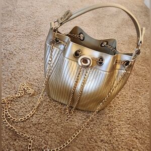 Bucket list or bucket bag? Gold bag-heavy plastic with threaded design. W/Chain